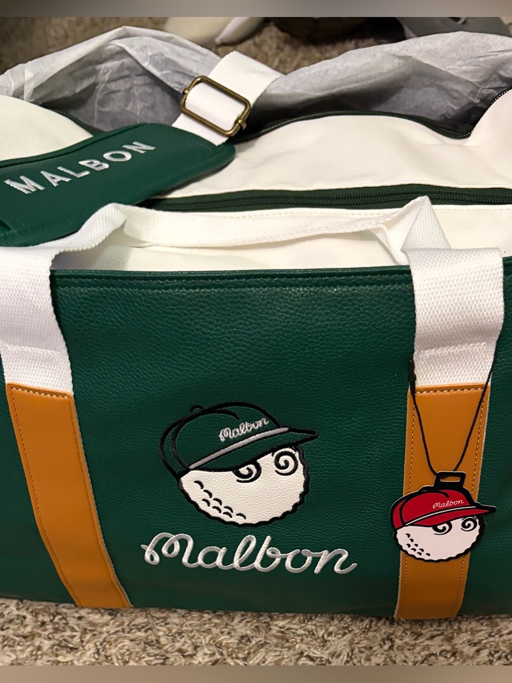 Malbon duffel bag green and white.